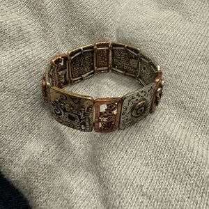 Golden  and Bronze Stretch Bracelet Says “JETSON” on the tag
